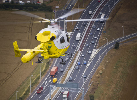 Helicopter over a road photographed from above