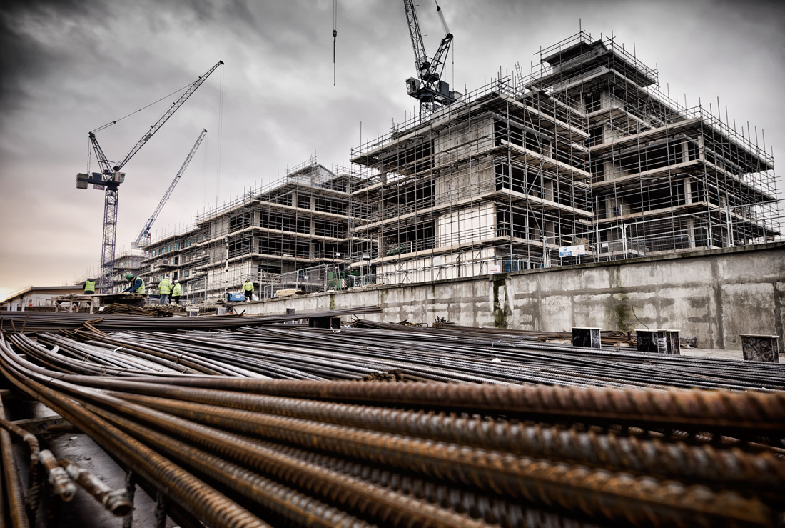 Large construction site with rebar in the foreground