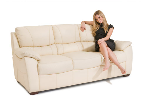 Model on a sofa for a furniture shop advert
