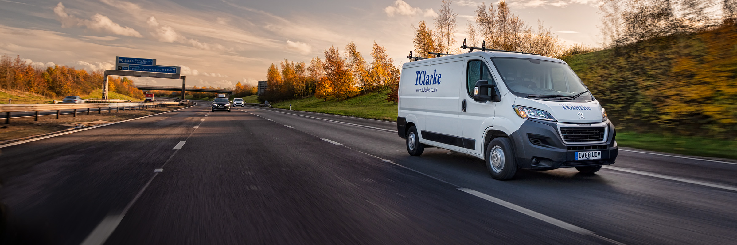 A van photographed travelling on a road, making deliveries.