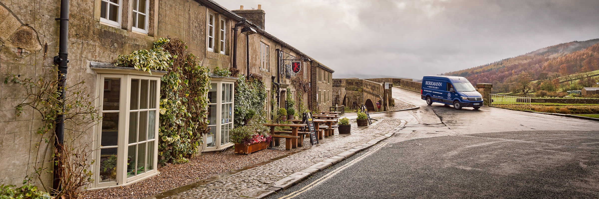 A van delivering wine to a small country village pub.