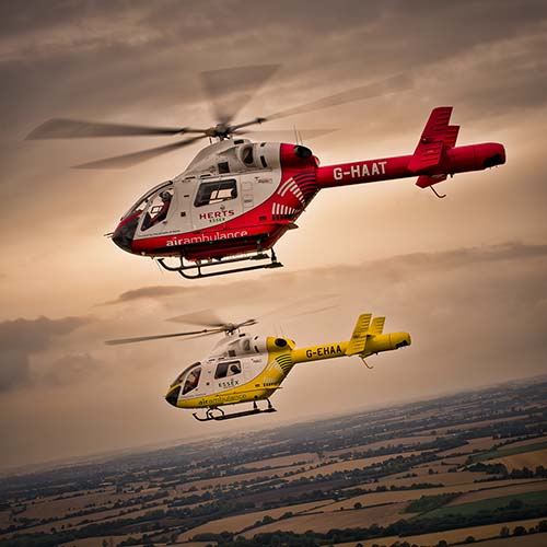 Two helicopters in flight