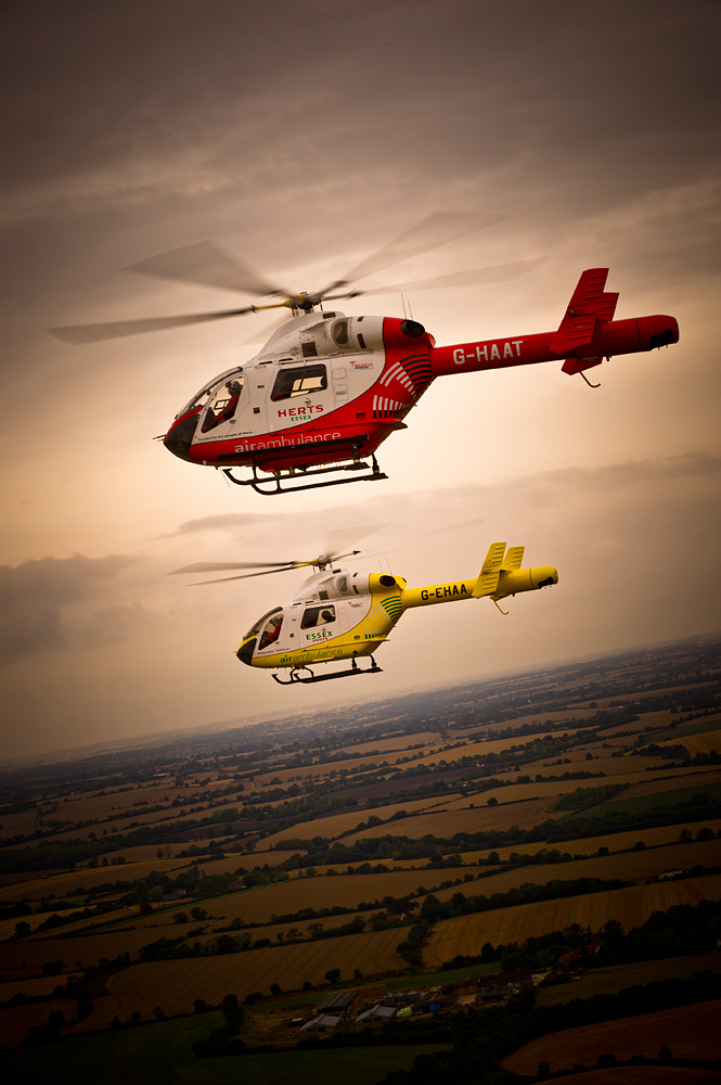 Two helicopters in flight