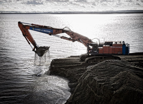 Digger dredging area for new port in Essex