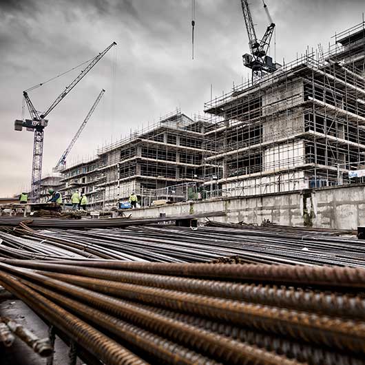 An East London construction site showing the concrete frame with steel rebar ready for use