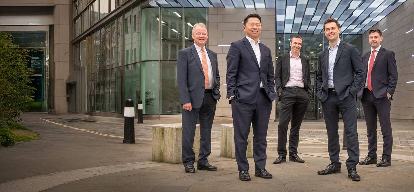 Group portrait photograph of the senior management team of a FTSE 350 company in the city of London
