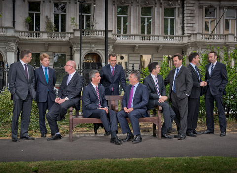 Group portrait of business men outside