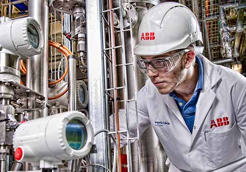 A student at Imperial Collage, London, checking dials in the ABB chemical engineering research facility