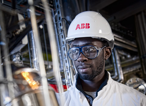 ABB worker checking data at a chemical plant