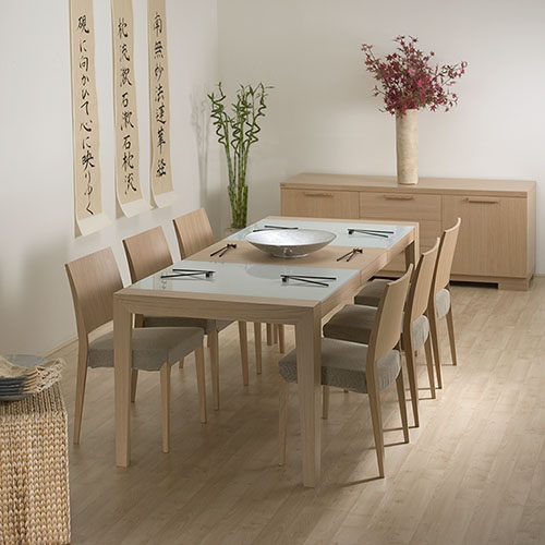 Oriental style dining room furniture in a light wood.