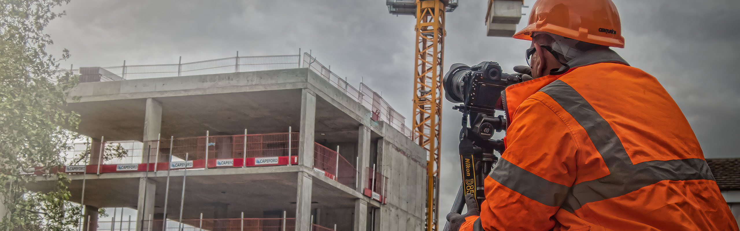 Professional photographer working with a camera on a tripod