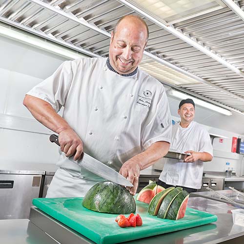 Photograph of a chef in a commercial kitchen in Central London