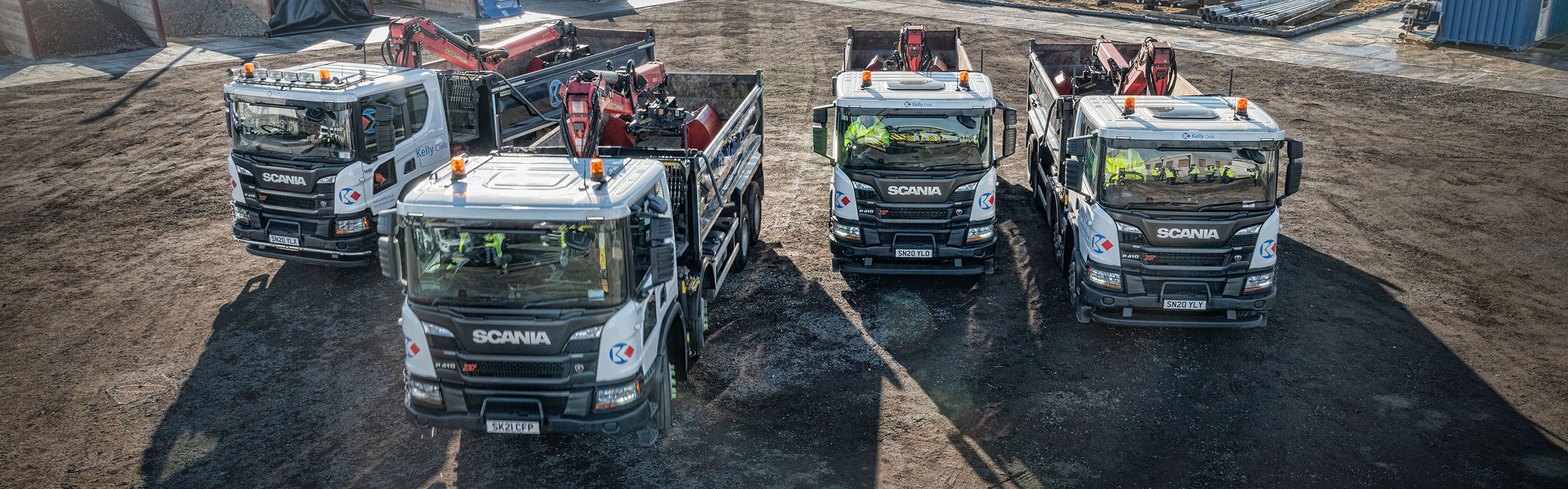 Four lorries in a yard from above