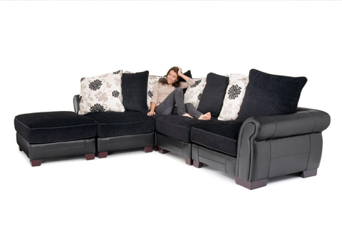 Large corner sofa with a model for furniture advertising