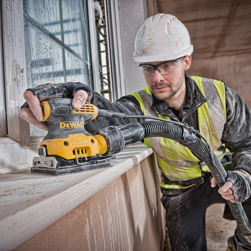 A deWalt sander being used in a new build house