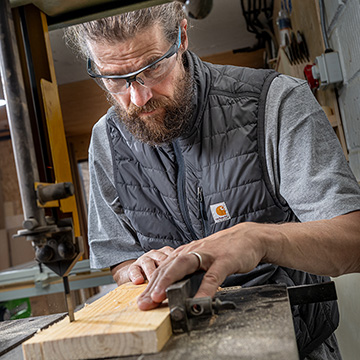 Carpenter using a band saw