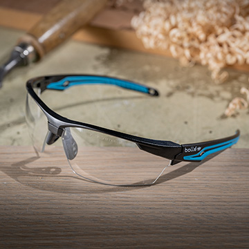 Pair of safety glasses on a work bench